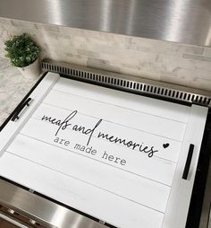 a kitchen stove with a sign that says meal and memories are made here on it