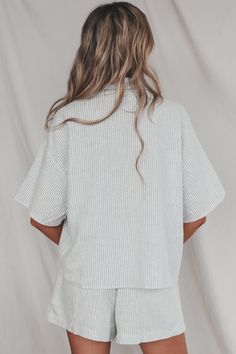 Looking for the perfect boat day attire? Look no further than this lightweight button up top. Pairs perfectly with our Having A Boat Day Striped Shorts. Blue and white boxy vertical stripe button down Material is Linen Hang to dry Model is 5'9 wearing a small SHOP THE LOOK Small Medium Large Length 23.5” 24.5” 25.5” Bust 22” 23” 24”