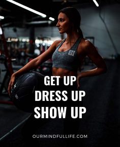 a woman holding a basketball in a gym with the words get up dress up show up