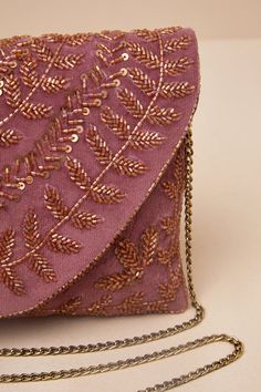 Pair any look with the Lulus Chic Guaranteed Mauve Velvet Beaded Clutch to create a perfectly put-together 'fit! Soft velvet shapes this cute clutch that features a classic rectangular silhouette with an intricate, brown beaded design across the front. The front flap boasts a hidden magnetic closure that lifts to reveal a lined interior with a sidewall pocket and plenty of room for all your necessities. Plus, an attached gold chain strap allows for crossbody wear whenever you want! Lined. Clutch Measure 10. 5" Wide 6. 5". Tall And 1' Deep50% Glass, 25% Polyester, 15% Cotton, 10% Iron. Imported. Lulus | Chic Guaranteed Mauve Velvet Beaded Clutch. Mauve Velvet, Velvet Clutch, Beaded Clutch, Velvet Bag, Bead Designs, Soft Velvet, Magnetic Closure, Chain Strap, Gold Chain