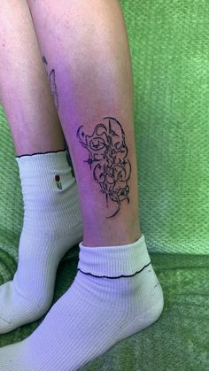 a person with a tattoo on their leg