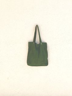 ON SALE Large green suede tote bag is a women tote bag for an every day use, this deep green suede bag is Made of soft green suede leather. Green leather handbag for women (Can be unisex, for both men and women). Soft and comfortable. This bag is one of a kind. Inside leather pocket Leather Handles Magnetic closure Unlined Very comfortable for carrying personal things, A4 files, i-pad , cosmetic bag and more. Available in 7 colors Green, black, gray, red, yellow, brown and blue. All bags are han Green Leather Canvas Bag For Everyday Use, Green Canvas Bag With Leather Handles For Daily Use, Green Leather Tote Canvas Bag, Green Suede Bags For Everyday Use, Green Suede Shoulder Bag For Everyday Use, Green Canvas Bag With Leather Double Handles, Dark Green Leather Bags For Daily Use, Green Leather Shopping Bags, Green Soft Leather Tote Bag