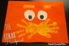 the lorax fingerprint is made with orange paper and black dots on it