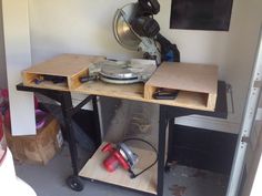 a workbench with tools sitting on top of it