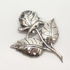 925 Sterling Silver Vintage Rose Floral Design Pin Brooch Weight: 15.8g WELCOME TO PAWN SHOP We are an actual pawn shop and have been in business for over 25 years. Since 1990, our establishment has been serving a variety of clients by providing them with short term cash solutions and options of liquidity regarding their treasured heirlooms. Acknowledging that today′s customers are very sophisticated and are looking for a variety of investments, our acquisitions are hand-picked for our special c Classic Silver Lapel Pin For Anniversary, Vintage Silver Lapel Pin For Anniversary, Vintage Rose Brooch Jewelry, Silver Vintage Anniversary Lapel Pin, Vintage Silver Anniversary Lapel Pin, Vintage Rose Jewelry With Brooch, Vintage Rose Brooches For Gifts, Vintage Rose Brooch, Vintage Rose Brooch For Gift