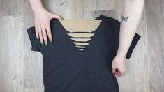 In this DIY t-shirt cutting tutorial, discover two easy t-shirt neckline cutting ideas that show how to cut a t-shirt into a v neckline. How To Cut Tshirt Neckline, How To Distress A Tshirt, Diy Distressed Shirt, Cut T Shirt Neckline, Diy Necklines, Tee Shirts Diy