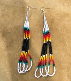 Authentic Beautiful Native American Indian Jewelry Navajo Hand Beaded Long Dangle Earrings. Great for a gift❤️ Handcrafted by Navajo Artist R. Sellers These beautiful earrings are approximately 6" in length and 1" in width. Native American Bead Earrings, Southwestern Style White Jewelry With Dangling Beads, Southwestern Style Beaded Earrings For Festival, Southwestern Style White Beaded Dangle Earrings, Southwestern Dangle Beaded Earrings, Southwestern Teardrop Beaded Earrings, Adjustable Southwestern Beaded Earrings, Southwestern Adjustable Dangling Bead Earrings, Cab Earrings Native American