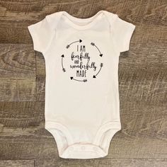 I'm Fearfully and Wonderfully Made Baby Bodysuit  This listing is for one (1) white bodysuit with black lettering on the front. Available in short sleeve.  Available Sizes:  Newborn 3 Month 6 Month 9 Month  12 Month  I hand make each bodysuit or one piece, no two will be exactly the same, please allow 3-7 business days for production. Please email me with any questions.  Want to see more, check us out on Facebook at http://www.facebook.com/williamandwesley Thank you for shopping! Fearfully And Wonderfully Made, Wonderfully Made, Cotton Bodysuit, White Bodysuit, Vinyl Lettering, Gender Neutral Baby, Baby Clothing, Baby Bodysuit, Onesies