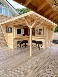 an outdoor bar with stools on the deck