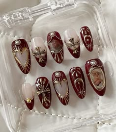 Art Deco Christmas Nails, Poinsettia Nail Art, Claret Nails, Baroque Nail Art, Greek Mythology Nails, Sun And Moon Nail Art, Nails With Gold Charms, Cherub Nails