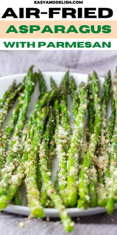 asparagus with parmesan on a white plate and text overlay reads air fried asparagus with parmesan