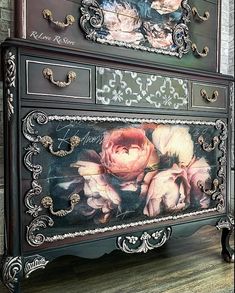 an ornate dresser with flowers painted on it