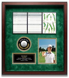 a golf memorabilia display with a green background and two pictures on the front of it