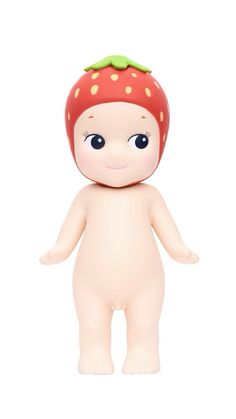 a toy doll with a strawberry on it's head and eyes, standing in front of a white background