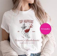 Custom Bachelorette Wine Shirt, Personalized Bridal Winery,Wine Tasting Shirts Bridesmaids Napa Valley, Wine Club Shirt  gift for her.Custom Bachelorette Wine Shirt.Celebrate your special day in style with our Custom Bachelorette Wine Shirt! Perfect for wine-loving brides and their bridal party, this personalized shirt combines elegance with a touch of fun, making it an ideal choice for winery tours, wine tastings, or bachelorette parties. Design Details: Eye-Catching Graphics: Featuring a whimsical wine glass spilling over with a delightful backdrop of luscious grapes, this design captures the spirit of your celebration. Sip Happens: The playful phrase "Sip Happens" is prominently displayed at the top, reminding everyone to enjoy the moment and savor the memories. Personalized Touch: At t Bachelorette Wine, Sip Happens, Custom Bachelorette, Wine Shirt, Napa Valley Wine, Winery Tours, Wine Club, Wine Shirts, Club Shirts