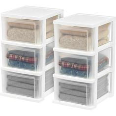 three clear plastic storage containers with clothes and blankets in them on top of each other