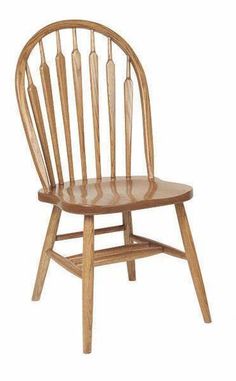 a wooden chair sitting next to each other on a white background