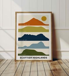 the scottish highlands poster is displayed in an empty room with wood flooring and white walls