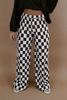 When comfort meets style. The All Things Checkered Velvet Pants will be turning heads. This checkered pant is featured in a, relaxed high stretch fit with a brown/white checkered pattern and high rise waistband for a true cool girl energy look. Waistband: Elastic Fabric: 100% Polyester Elastic waistband High stretch fabrication Wide leg bottom Imported Fit: True to size!- Waistband: Elastic- Leg: Wide leg- Generous stretchModel Specs: Emily + Karli are wearing a size small in the photo.How will this item fit you? Check out our MODEL SPECS (Typical Sizing - Karli: S-Size 5/26 - 5ft 2in, Emily: S-Size 3/25 - 5ft 5in, Syd: L/XL- Size 15/ - 5ft 8in)﻿Need help with sizing? No problem! Join our VIP group on Facebook, Everyday Chic Boutique VIP Insiders to chat directly with our team and other cu Checkered Pants Outfit, Checkered Clothes, Velvet Pant, Girl Energy, Closet Wishlist, Checkered Pants, Velvet Pants, Elastic Fabric, Edgy Outfits