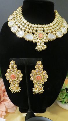 This beautiful choker is a modern twist to traditional jewelry and comes in a gold finish to match any outfit as desired. The choker is made of high quality stones and is a statement piece that can be dressed accordingly. The set comes with matching earrings and Tikka for a complete look. Kundan Bridal Necklace With Matching Earrings In Temple Style, Designer Gold Necklace For Festive Occasions, Designer Kundan Gold Necklaces, Designer Gold Kundan Necklace, Designer Kundan Gold Necklace, Designer Gold Kundan Necklace For Gift, Designer Gold Necklaces For Festive Season, Designer Chandbali Jewelry For Festivals, Designer Chandbali Jewelry For Festive Occasions