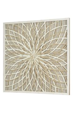 an intricately designed piece of art made out of white paper and wood, on a white background