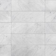 a white marble tile wall that looks like it could be used as a floor covering