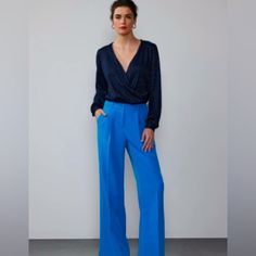 Wear These Beautiful Wide Leg Trousers Alone Or Bundle With The Coordinating Vest Which Is Also Being Sold Separately To Create The Perfect Power Suit. The Deep Azure Blue Color Is A Gorgeous Alternative To The Standard Neutral. Us Size: 14 Length Waist To Hemline: 43” Waist: 32-33” Fabrics: 80% Polyester, 11% Spandex Blue Trousers Outfit Casual, Royal Blue Dress Pants Outfit, Chic V-neck Business Casual Pantsuit, Tailored Blue Elegant Bottoms, Tailored Elegant Blue Bottoms, Elegant Tailored Blue Bottoms, Blue Bottoms For Summer Evenings, Blue Bottoms For Summer Evening, Elegant Blue Pantsuit For Formal Occasions