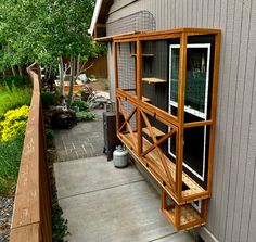 an outside view of a house with a bird cage on the porch