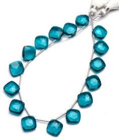 a necklace made with blue glass beads