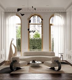 an elegant living room with white furniture and large windows