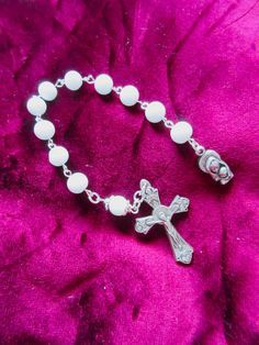 This Catholic pocket rosary is made with 8mm white glass beads, an Italian made oxidized silver crucifix and an Italian made, oxidized silver Mother and Child medal. It is 1 decade and measures 8.75 inches long. I hand turned the silver plated wires. It will be slipped into a small velvet pouch and slipped into a bubble mailer. White Crucifix Rosary With Miraculous Medal, White Spiritual Rosary With Miraculous Medal, Spiritual White Rosary With Miraculous Medal, White Rosary With 8mm Beads Crucifix, White Spiritual Rosary Bracelet With 8mm Beads, White Spiritual Rosary For Baptism, White Cross Rosary Bracelet For First Communion, White Spiritual Rosary Bracelet With Cross, White Cross-shaped Rosary For Baptism