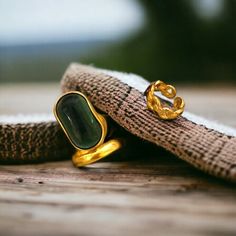 Elevate your style with our exquisite collection of vintage green stone rings. Our gold band and chain rings are perfect for adding a touch of glamour to any outfit. Whether you're looking for a statement piece or a charming gift, our women's jewelry will surely impress. Embrace the essence of streetwear fashion with our stocking ring set. Discover the perfect ring to make a fashionable statement. *Beautiful and charming sterling silver ring with a gold stone (925 stamped) *Adjustable *This ring is stylish and pretty ideal for everyday use. * Gender: Female *Ready to Ship in 1-2 Business Days * The product will be sent to you nicely packages and ready for gift giving. * Visit our store, browse other jewelry, silver, and gold collections, and find the perfect piece you're looking for. ♥️ Lo Gold Plated Open Ring With Gemstone, Trendy Gemstone Ring Jewelry, Trendy Gemstone Ring, Gold Plated May Birthstone Ring, Vintage Gold Plated Open Ring Jewelry, Elegant Green Crystal Ring With Metal Band, Vintage Gold Emerald Open Ring, Green Open Ring Made Of Metal, Elegant Emerald Ring Gift Tarnish Resistant