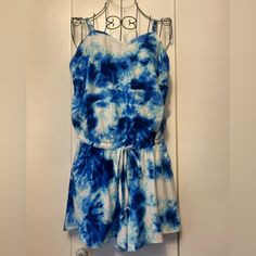 This Blue And White Tie Dye Romper Is So Adorable! It’s Super Soft And Materials Of Polyester And Spandex. The Waist Has A Tie Belt. The Straps Are Adjustable Too. Great For Summer! *From A Smoke-Free Home. Blue Cotton Jumpsuits And Rompers For Vacation, Casual Blue Jumpsuits And Rompers For Beach, Casual Blue Jumpsuits And Rompers For Beach Season, Blue Summer Jumpsuits And Rompers For Loungewear, Sleeveless Tie-dye Dresses For Spring, Blue Tropical Print Tie-side Swimwear, Spring Tie-dye V-neck Dress, Beachy Tie-dye Swimwear, Spring Sleeveless Tie-dye Jumpsuits And Rompers