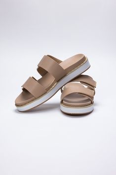 Step into summer with the Bethany Sandal from Shu Shop. Made with a faux leather upper and footbed, these sandals are both stylish and comfortable. The adjustable hook and loop closure ensures the perfect fit, while the cupped footbed provides support. Finished with gold stud detailing, these sandals are a must-have for your warm weather wardrobe. All Man Made Materials True To Size Gold Leather Footbed Sandals For Beach, Adjustable Strap Slip-on Footbed Sandals For Vacation, Flat Sport Sandals With Leather Footbed, Spring Slip-on Sport Sandals With Buckle Closure, Flat Heel Synthetic Footbed Sandals With Removable Insole, Double Strap Cushioned Footbed Sandals For Beach, Cushioned Double Strap Footbed Sandals For Beach, Flat Synthetic Footbed Sandals With Removable Insole, Double Strap Slides With Cushioned Footbed For The Beach