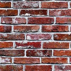 a red brick wall is shown with white paint on the top and bottom half of it