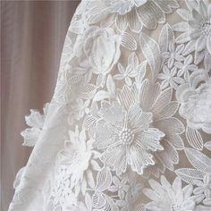 white lace with flowers and leaves on it