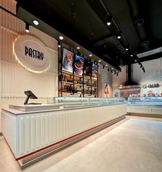 the interior of a restaurant with an empty counter