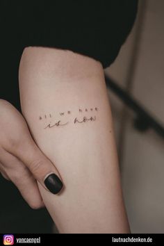 a woman's arm with writing on it