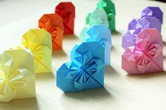 several origami pieces are arranged on a table