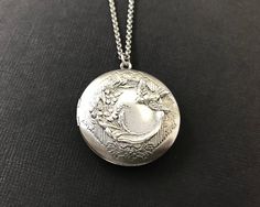 Antique Silver Bird Floral Locket.... I have attached an antique silver bird and floral brass stamping to a beautiful floral antique silver brass locket. The locket is suspended from a high quality antique silver rolo chain with soldered links. The chain closes with a lobster claw clasp. This sweet bird locket looks even better in person! It will be sent to you gift wrapped. A great gift to give your wife, girlfriend, best friend, grandmother or mom on Valentine's Day or a special occasion! Give