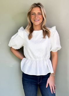 Be effortlessly stylish all year round with our Audrey Puff Sleeve Top! The textured print adds a playful touch and the ruffle details make it girly and flirty. With puff sleeves and available in two colors, wear it to work, play, or game day! True to Size Olivia is 5'6 wearing small Color: White Puff sleeves with ruffle detail Round neckline Textured print Not Lined Pull on fit Fabric: 100% Polyester Floral Dress Casual, Black Short Dress, Puff Sleeve Top, Dress With Cardigan, Dressy Casual, Floral Dress Black, Casual Blouse, Headband Hairstyles, Dress Romper