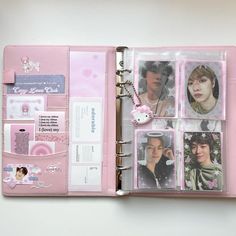 a pink binder with photos and stickers attached to the inside of an album