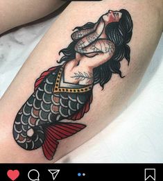 a woman's leg with a tattoo on it and an image of a fish