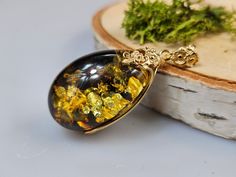 Welcome to handmade Baltic Amber jewelry shop. This Item is made of genuine, natural Amber. This item will make You look simple but gorgeous.  Length: ~ 2,3 x 5,3  cm  Amber and gold jeweler. Big green very elegant Baltic Amber pendant. Handmade Amber jewelry. Gold plated sterling silver 925. High quality jewelry.  Our handmade jewelry is made with passion and love. If you have any problems with your order please contact us. Please note that colors can vary from originals depending on computer m Handmade Baltic Amber Gold Necklaces, Elegant Handmade Tortoiseshell Jewelry, Cabochon Baltic Amber Necklace As Gift, Baltic Amber Cabochon Necklace For Gift, Gold Baltic Amber Necklace For Gift, Amber Oval Cabochon Jewelry For Gifts, Gold Baltic Amber Necklace, Gold Baltic Amber Round Necklace, Baltic Amber Pendant Jewelry Gift