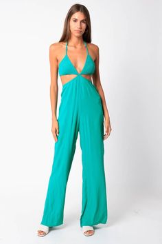 The cutest summer jumpsuit! Featuring a smocking bust, and cut outs. Fits true to size! Sami is 5'9" and wearing a medium. Solid Color One-piece Jumpsuits For Summer, Beach Summer Jumpsuits And Rompers, Summer Jumpsuits And Rompers For Beach, Summer Halter Neck Jumpsuits And Rompers For Loungewear, Summer Stretch Jumpsuits And Rompers For Loungewear, Casual Strapless Jumpsuit For Summer Parties, Spring Strapless Halter Neck Jumpsuit, Trendy Beach Overall Jumpsuits And Rompers, Summer One-piece Jumpsuits And Rompers