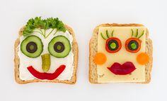 two slices of bread with faces painted on them