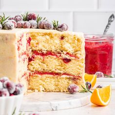 a cake that has been cut into pieces and is sitting on a table with orange slices