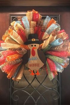 a colorful wreath with a turkey on it