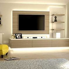 a modern living room with white walls and yellow furniture in front of the flat screen tv