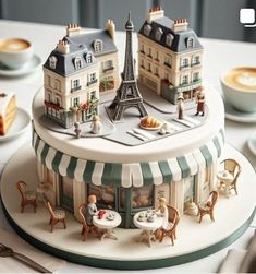 there is a cake that looks like the eiffel tower on top of it